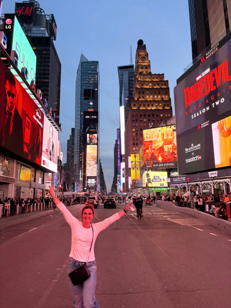 new york with kids times square woman standing in the middle of the street